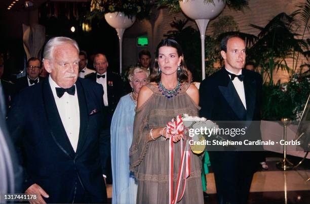 Prince Rainier III of Monaco, Princess Caroline of Monaco and Prince Albert II of Monaco attend the Red Cross Ball on August 5, 1994 in Monaco,...