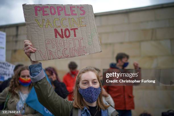 Members of a group called "The People's Vaccine" protest outside the Macclesfield AstraZeneca site as they call for the pharmaceutical company to...