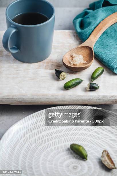 high angle view of ingredients on table - finger lime stock pictures, royalty-free photos & images