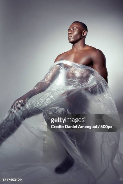 young man wrapped in plastic,palma,islas baleares,spain - man wrapped in plastic stock pictures, royalty-free photos & images