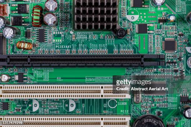 section of a computer circuit board photographed close up, united kingdom - computer part stock-fotos und bilder