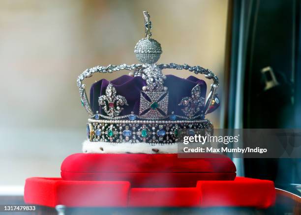 The Imperial State Crown is driven down The Mall, in a Rolls Royce Phantom VI, en route to the Houses of Parliament where Queen Elizabeth II is to...