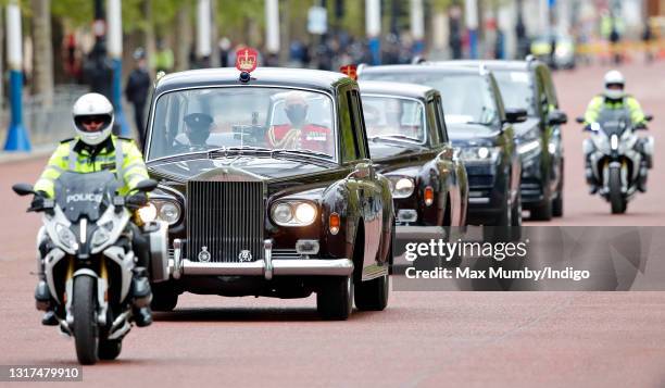 The Imperial State Crown, accompanied by Lieutenant Colonel Michael Vernon is driven down The Mall, in a Rolls Royce Phantom VI car led by a...