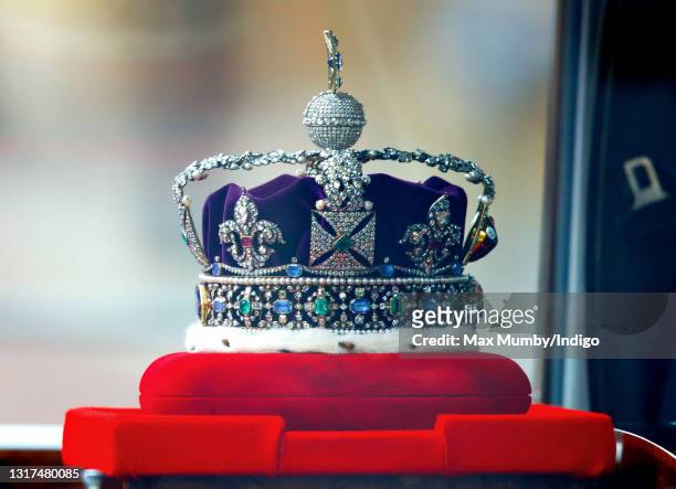 The Imperial State Crown is driven down The Mall, in a Rolls Royce Phantom VI, en route to the Houses of Parliament where Queen Elizabeth II is to...