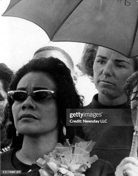 Coretta Scott King sits under an umbrella at Cardozo High School in Washington, D.C. With Ethel Kennedy directly in back of her at the Poor People's...