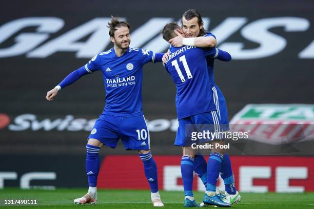 Caglar Soyuncu of Leicester City celebrates with team mates James Maddison and Marc Albrighton after scoring their side's second goal during the...