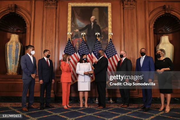 Speaker of the House Nancy Pelosi participates in the mock swearing-in ceremony for Rep.-elect Troy Carter as his wife, Army Reserve Brigadier...