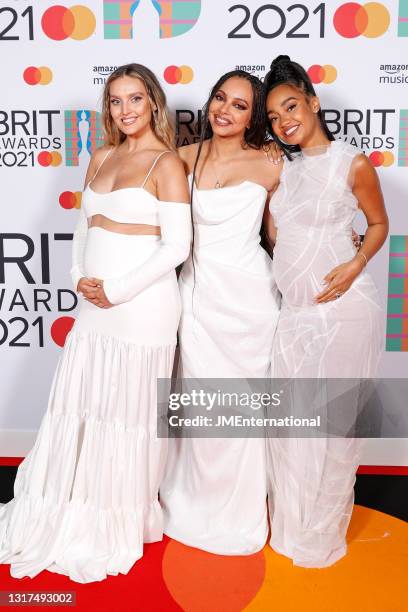 Perrie Edwards, Jade Thirlwall and Leigh-Anne Pinnock of Little Mix pose in the media room during The BRIT Awards 2021 at The O2 Arena on May 11,...