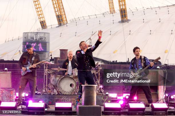 In this image released on May 11, 2021 Jonny Buckland, Will Champion, Chris Martin and Guy Berryman of Coldplay perform at The Brit Awards 2021 at...