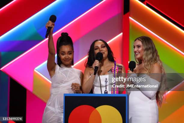 Leigh-Anne Pinnock, Jade Thirlwall and Perrie Edwards of Little Mix on stage after winning the British Group award during The BRIT Awards 2021 at The...