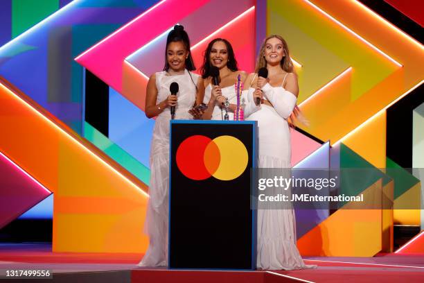 Leigh-Anne Pinnock, Jade Thirlwall and Perrie Edwards of Little Mix on stage after winning the British Group award during The BRIT Awards 2021 at The...