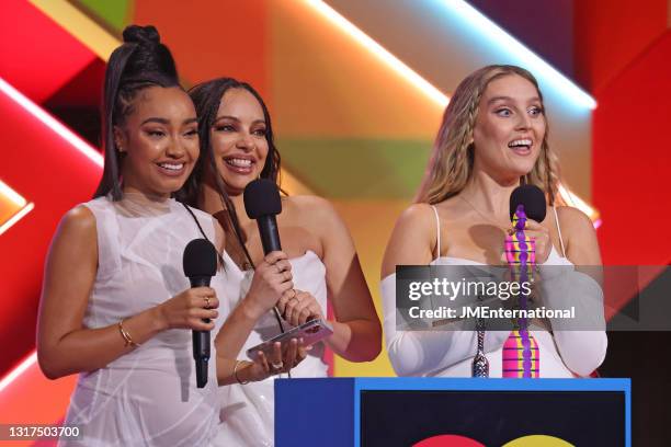 Leigh-Anne Pinnock, Jade Thirlwall and Perrie Edwards of Little Mix on stage after winning the British Group award during The BRIT Awards 2021 at The...