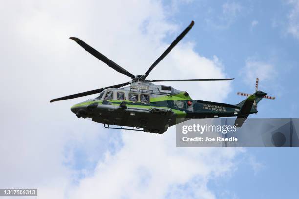 Miami-Dade Fire Rescue helicopter flies overhead at the ValuJet Flight 592 Memorial during a remembrance ceremony to commemorate the 25th anniversary...