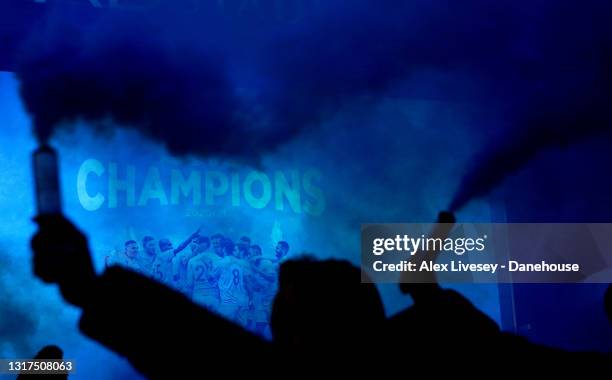 Manchester City fans celebrate winning the Premier League title outside Etihad Stadium on May 11, 2021 in Manchester, England. Manchester City...