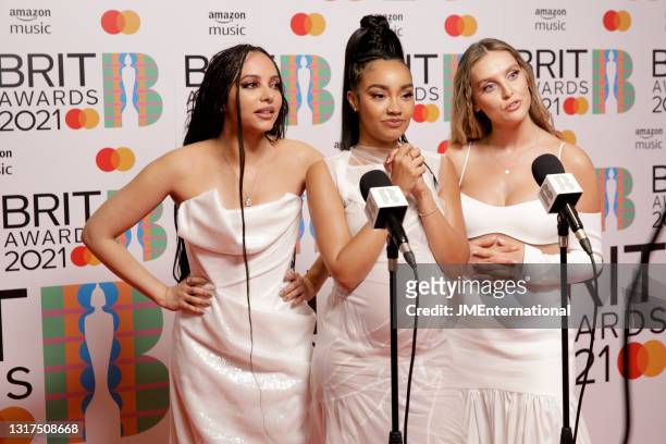 Jade Thirlwall, Leigh-Anne Pinnock and Perrie Edwards of Little Mix are interviewed in the media room during The BRIT Awards 2021 at The O2 Arena on...