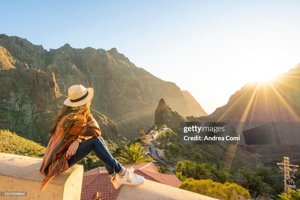 Tourist admiring Masca village at sunset. Masca, Tenerife, Canary Islands