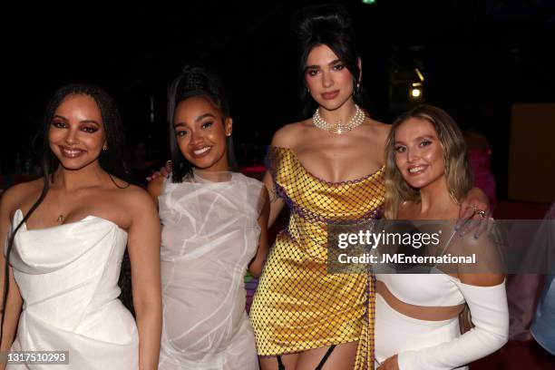 Dua Lipa poses with Jade Thirlwall , Leigh-Anne Pinnock and Perrie Edwards during The BRIT Awards 2021 at The O2 Arena on May 11, 2021 in London,...