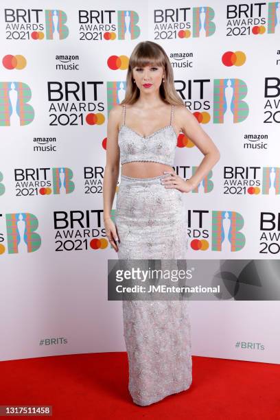 Taylor Swift, winner of the Global Icon Award poses in the media room during The BRIT Awards 2021 at The O2 Arena on May 11, 2021 in London, England.