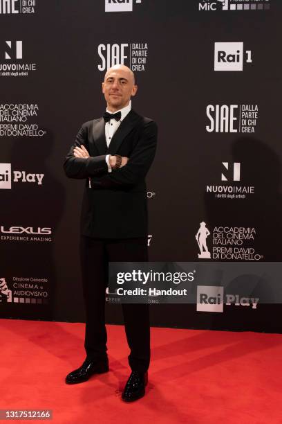 In this handout image provided by Accademia Del Cinema Italiano, Elio Germano attends the 66th David Di Donatello 2021 prize ceremony photocall on...