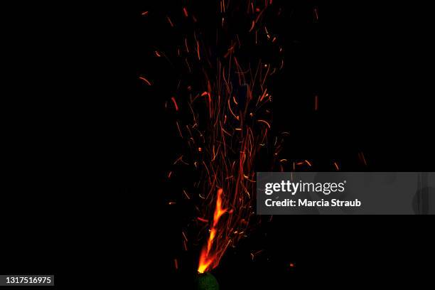 abstract vibrant red sparks against a black background - sparks stock pictures, royalty-free photos & images