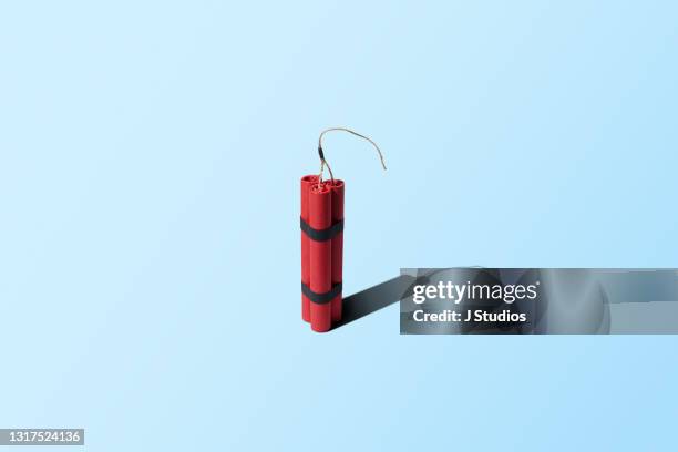 a bundle of dynamite standing upright - firework explosive material stock pictures, royalty-free photos & images