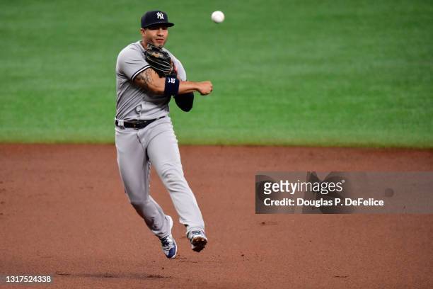 Gleyber Torres of the New York Yankees fields a ball during the first inning against the Tampa Bay Rays at Tropicana Field on May 11, 2021 in St...