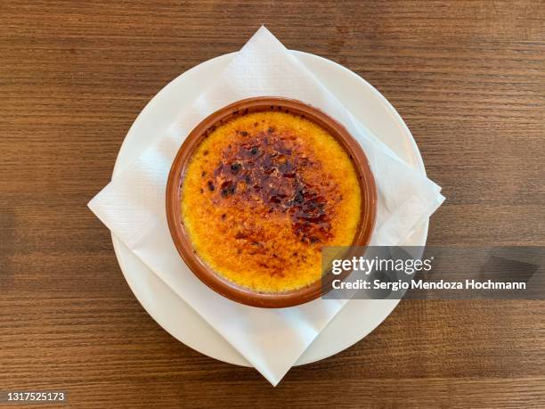 french cuisine - crème brûlée, or burned cream, custard, for dessert - creme brulee stock pictures, royalty-free photos & images