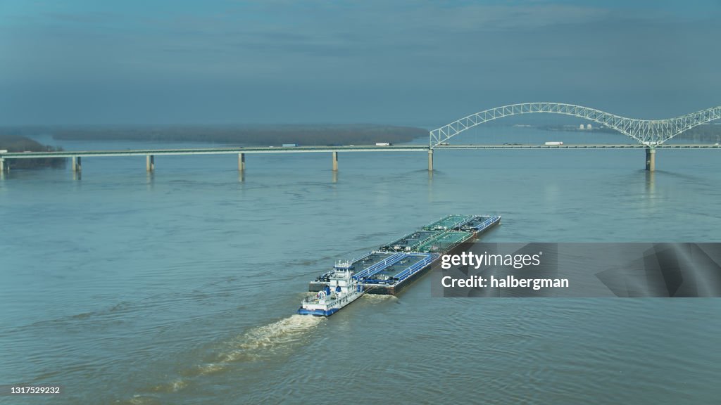 Aerial Shot of Barge Approaching Hernando de Soto Bridge on the Mississippi