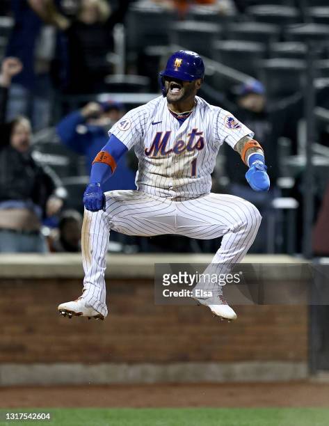 Jonathan Villar of the New York Mets celebrates after he scored the game winning run on a fielder's choice in the bottom of the ninth against the...