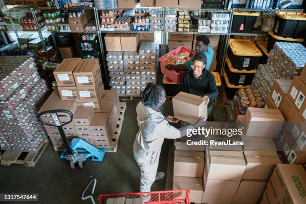 community care at local food bank - banco alimentar imagens e fotografias de stock