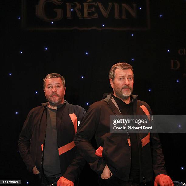 Philippe Starck poses next to his wax figure at Musee Grevin on June 15, 2010 in Paris, France.