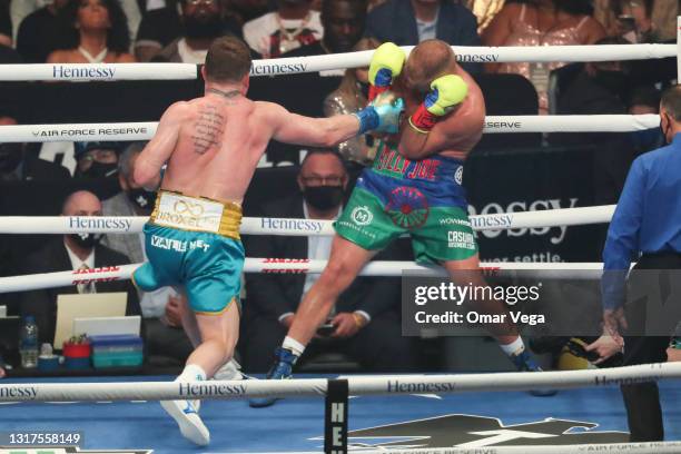 Saul Canelo Alvarez and Billy Joe Saunders fight during WBC, WBA Super, WBO and Ring Magazine World Super-Middleweight unification at AT&T Stadium on...