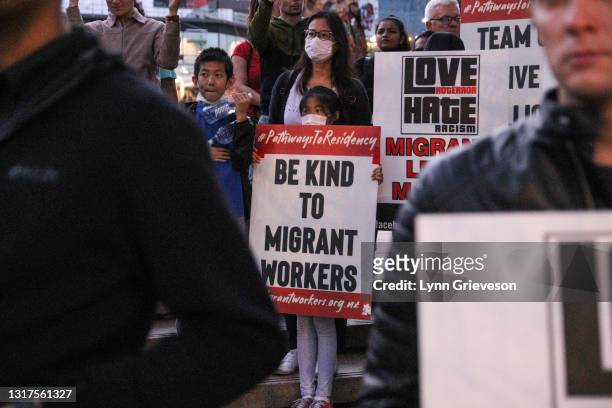 Supporters of the newly-formed Federation of Aotearoa Migrants hold a candlelit vigil and rally in Aotea Square on May 12, 2021 in Auckland, New...