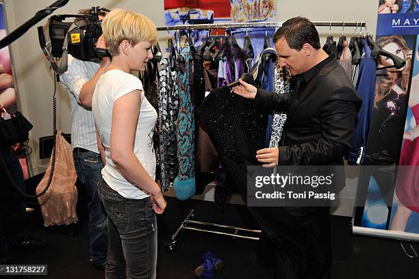 Designer Guido Maria Kretschmer and Karen Heinrichs are seen backstage at the Guido Maria Kretschmer Show during the Mercedes Benz Fashion Week...