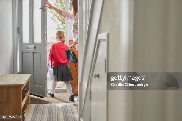 mother and daughter leaving the house to go to school - leaving school imagens e fotografias de stock