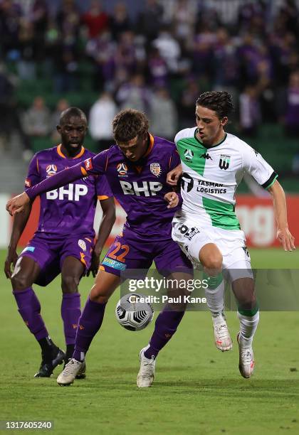 Joshua Rawlins of the Glory and Lachlan Wales of Western United contest for the ball during the A-League match between Perth Glory and Western United...