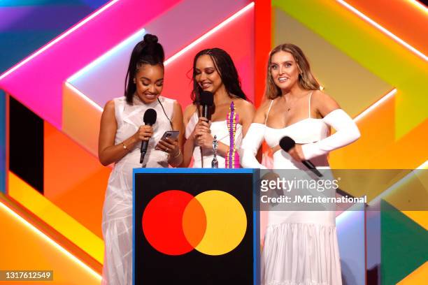 Leigh-Anne Pinnock, Jade Thirlwall and Perrie Edwards of Little Mix on stage after winning the British Group award during The BRIT Awards 2021 at The...
