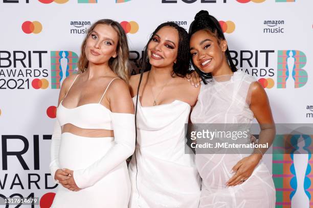 Leigh-Anne Pinnock, Jade Thirlwall and Perrie Edwards of Little Mix pose in the media room during The BRIT Awards 2021 at The O2 Arena on May 11,...