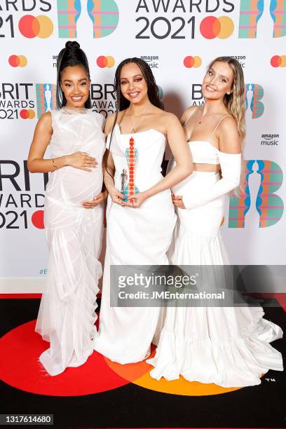 Leigh-Anne Pinnock, Jade Thirlwall and Perrie Edwards of Little Mix pose in the media room during The BRIT Awards 2021 at The O2 Arena on May 11,...