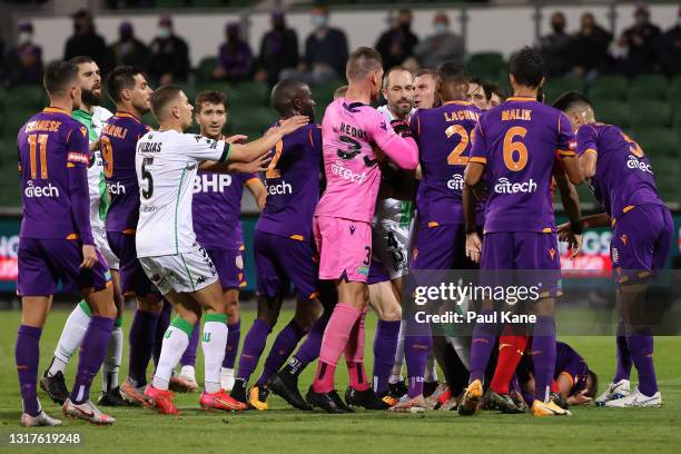 Liam Reddy of the Glory remonstrates with Besart Berisha of Western United as Callum Timmins of the Glory lays on the ground during the A-League...