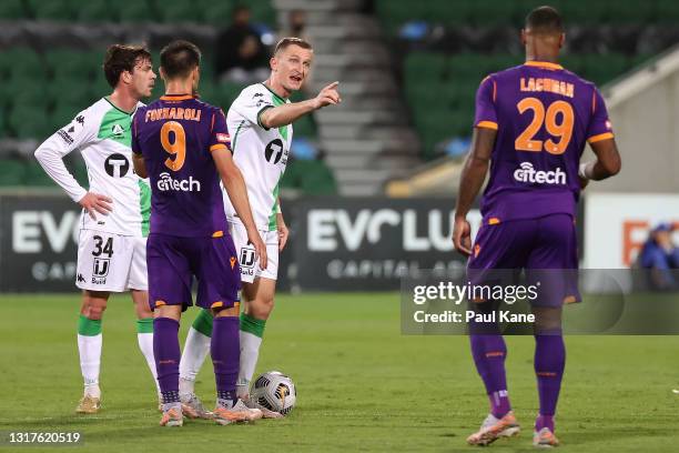 Besart Berisha of Western United exchanges words with Darryl Lachman of the Glory during the A-League match between Perth Glory and Western United FC...