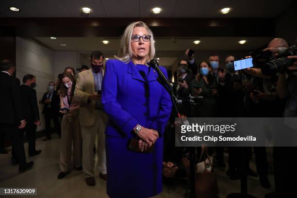 Rep. Liz Cheney talks to reporters after House Republicans voted to remove her as conference chair in the U.S. Capitol Visitors Center on May 12,...
