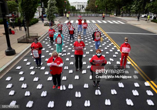 Nurses affiliated with the group National Nurses United read the names of registered nurses who died during the coronavirus pandemic while...