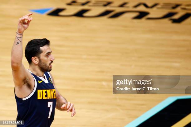 Facundo Campazzo of the Denver Nuggets reacts following a three point basket during the fourth quarter of their game against the Charlotte Hornets at...