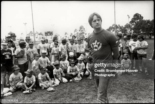 View of American baseball player Steve Howe , of the Los Angeles Dodgers, as he attends a Little League event for young players, Glendale,...