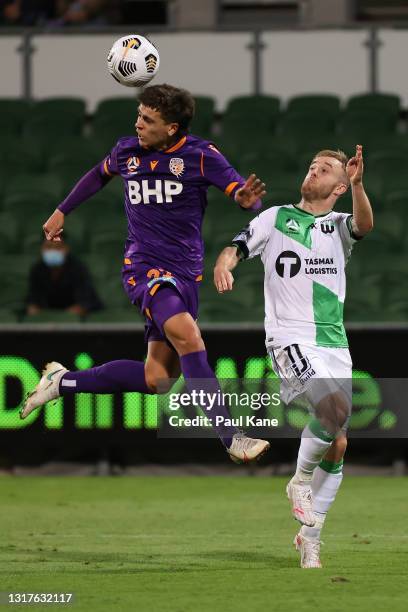 Joshua Rawlins of the Glory heads the ball against Connor Pain of Western United during the A-League match between Perth Glory and Western United FC...