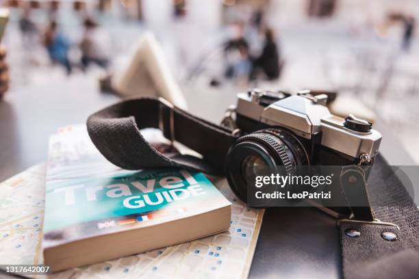 travel essentials on the table - guidebook stock pictures, royalty-free photos & images