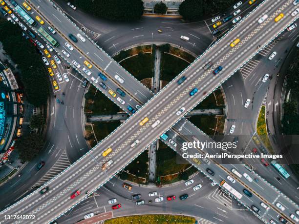 top view of road intersection and busy overpass - crossroad fotografías e imágenes de stock
