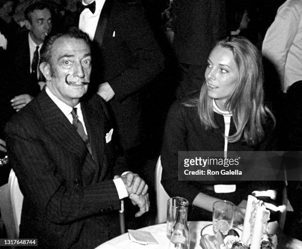 Salvador Dali and Amanda Lear attend Martha Salutes Valentino Fashion Show at the St. Regis Hotel in New York City on February 22, 1967.