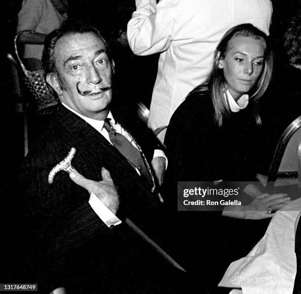 Salvador Dali and Amanda Lear attend Martha Salutes Valentino Fashion Show at the St. Regis Hotel in New York City on February 22, 1967.